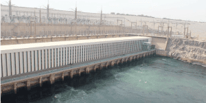 Wide view of the Aswan High Dam in Egypt overlooking the water.