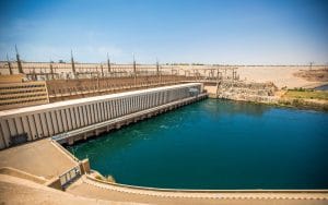 A wide-angle view of the Aswan High Dam and Lake Nasser, showcasing the modern engineering marvel that controls the Nile River in Egypt.
