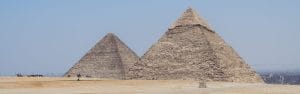 A panoramic view of the Great Pyramids of Giza under a clear blue sky, a key highlight of the private day tours from Hurghada offered by Top Class Egypt Travel.