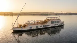 Luxury cruise boat sailing at sunset - jubal dahabiya