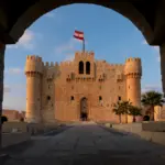 The historic Citadel of Qa15 Days Honeymoon Egypt - Citadel of Qaitbay in Alexandriaitbay, a 15th-century defensive fortress located on the Mediterranean Sea coast in Alexandria, Egypt.