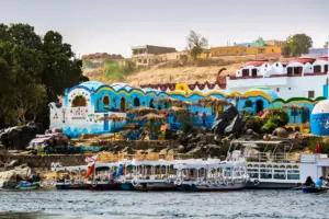 Scenic view of the Nile Ri15 Days Honeymoon Egypt - Scenic view of the Nile Riverver with traditional boats and colorful buildings on the way to the Nubian Village in Aswan