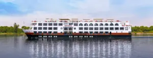 Full starboard view of Mövenpick MS Sun Ray cruising along calm Nile waters under a blue sky