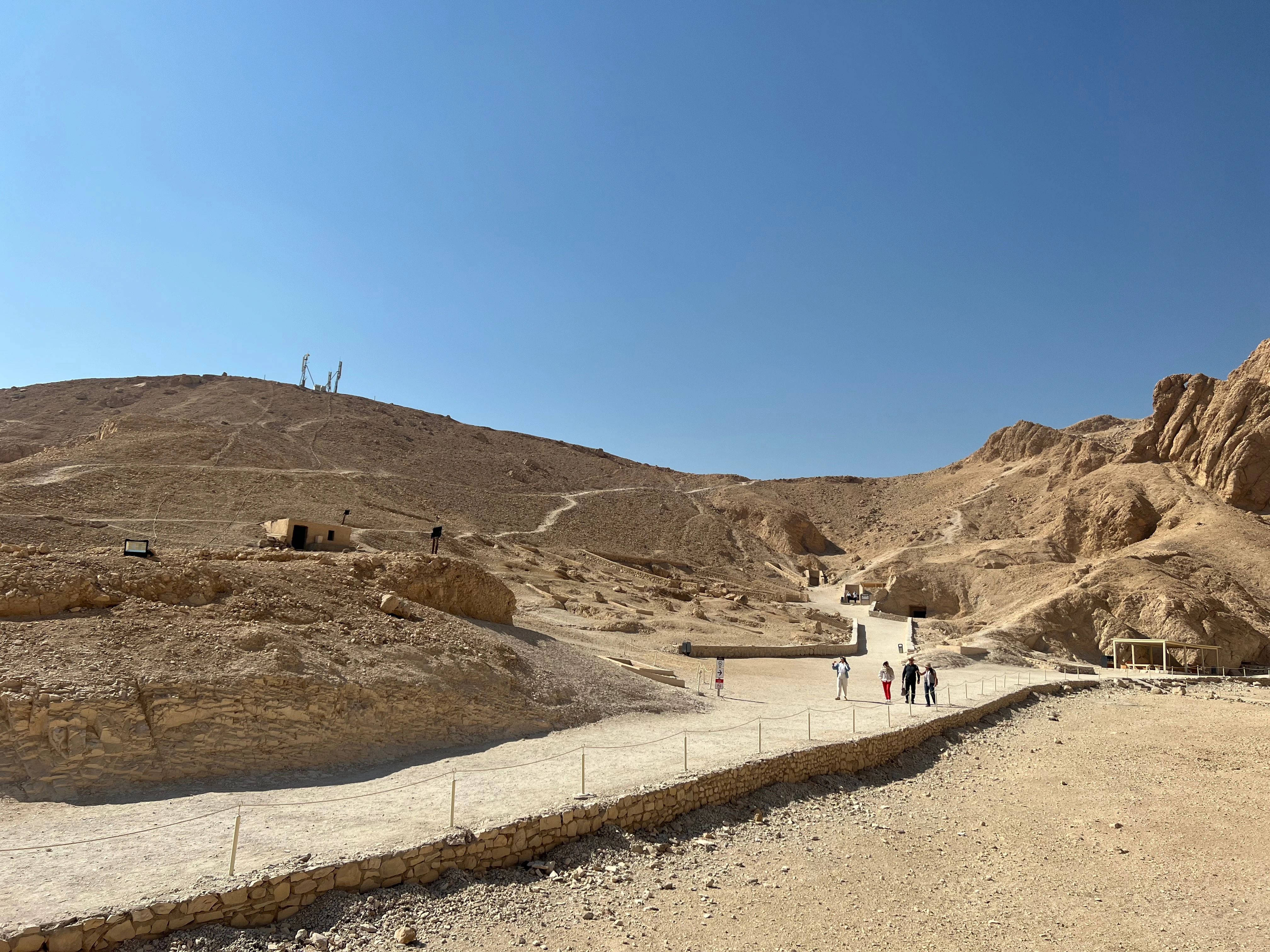 The sun-drenched inner courtyard of Medinet Habu, featuring massive columns and military reliefs of Ramses III, captured on a Top Class Egypt Travel VIP tour.