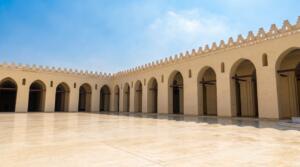 The beautiful stone facade of Al-Aqmar Mosque on Al-Muizz Street, representing the best Islamic Cairo attractions.