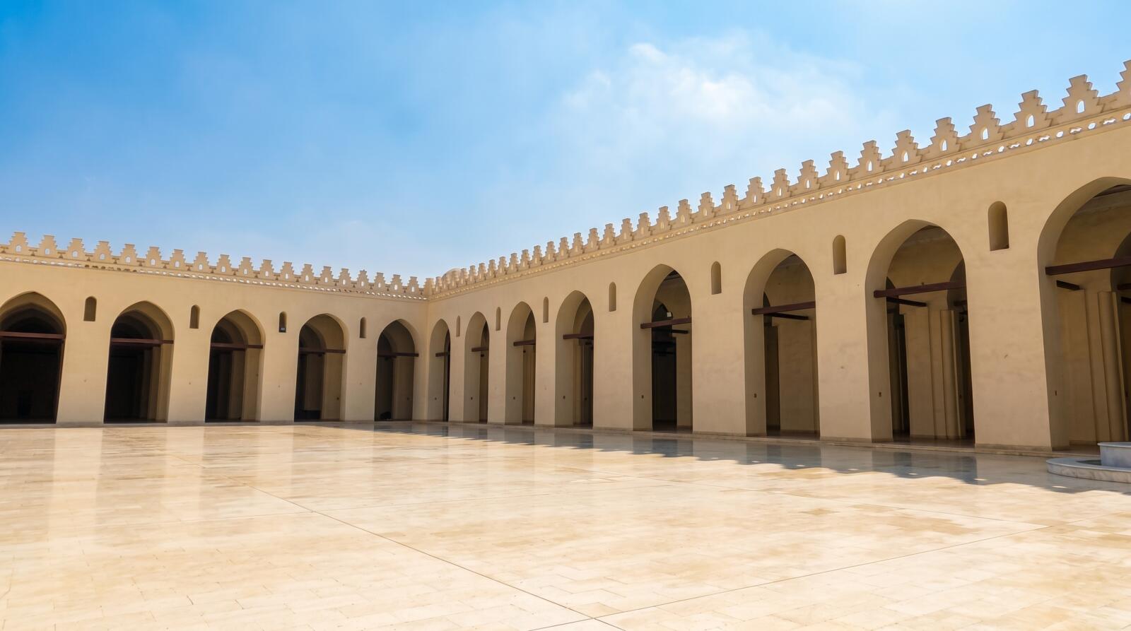 The beautiful stone facade of Al-Aqmar Mosque on Al-Muizz Street, representing the best Islamic Cairo attractions.